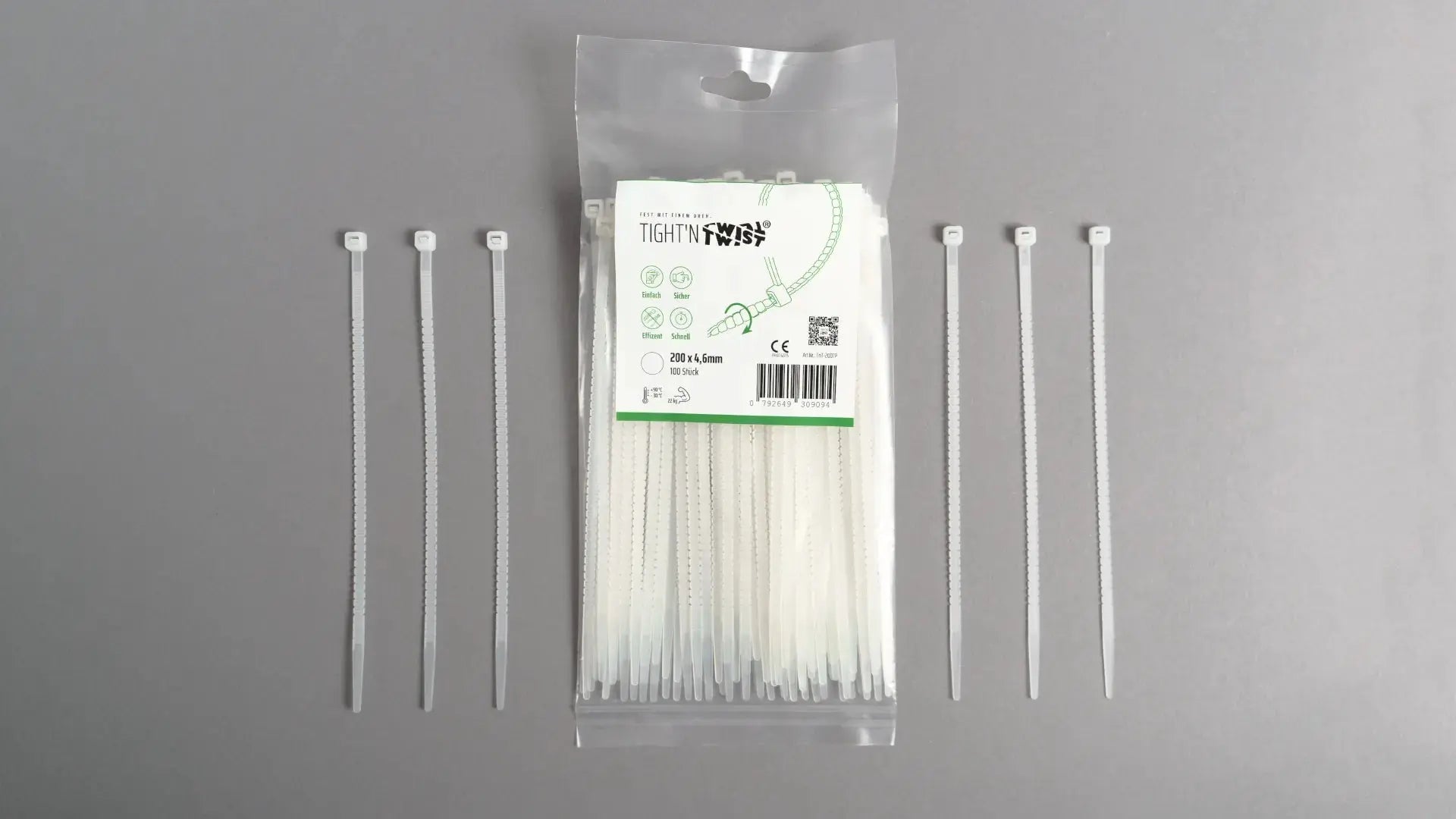Ein Tight'n Twist Kabelbinder 200x4p6 mm in Weiß liegt neben der Originalverpackung – Detailansicht des innovativen Designs
